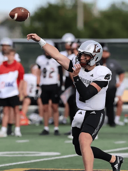TOP PHOTO: Kyle Haas throws a pass during a game at UW-Oshkosh on Oct. 3, 2026 (PHOTO: UW-O athletics).